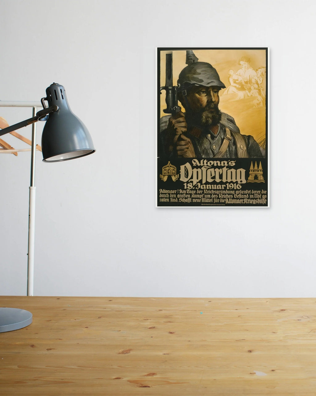 "Altona's Sacrifice – Remember the Fallen" poster above a wooden desk