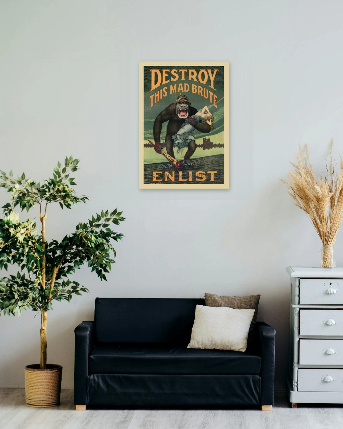 "Destroy This Mad Brute" poster on a living room wall
