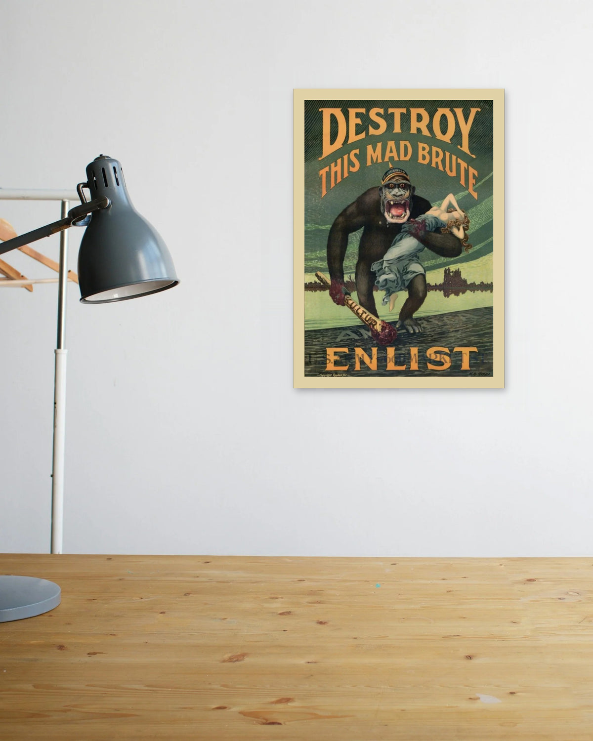 "Destroy This Mad Brute" poster above a wooden desk
