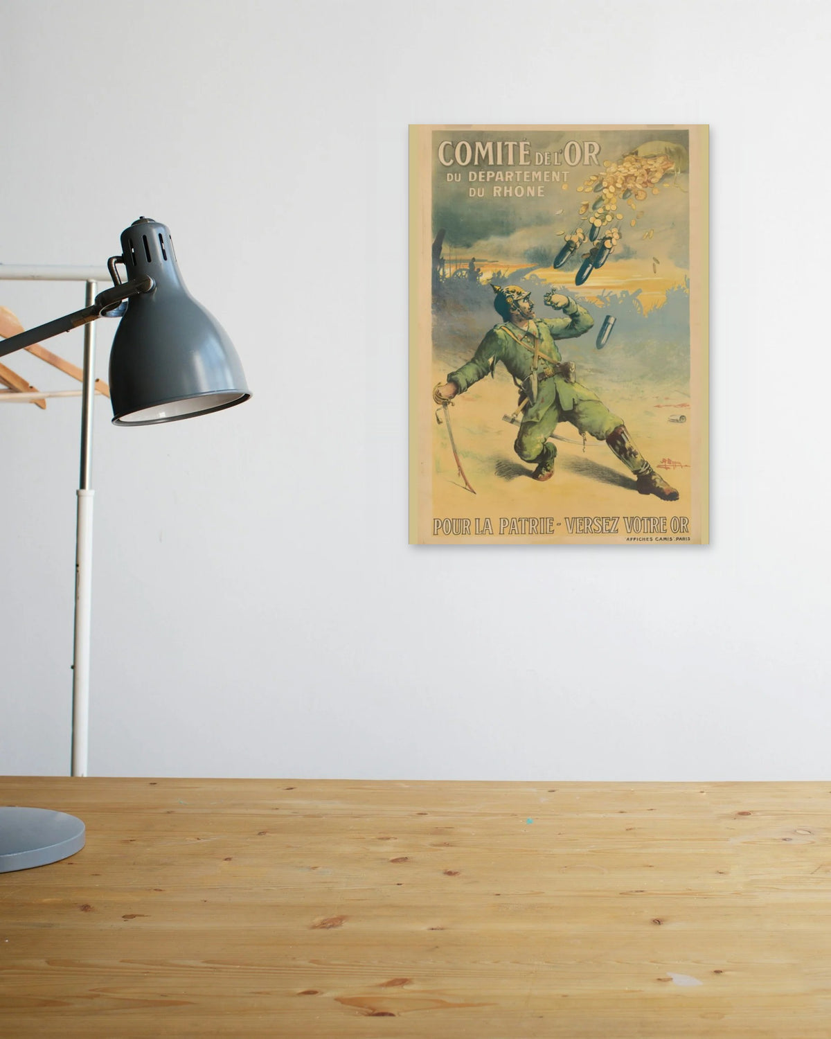 "Donate Your Gold – For the Fatherland" poster above a wooden desk