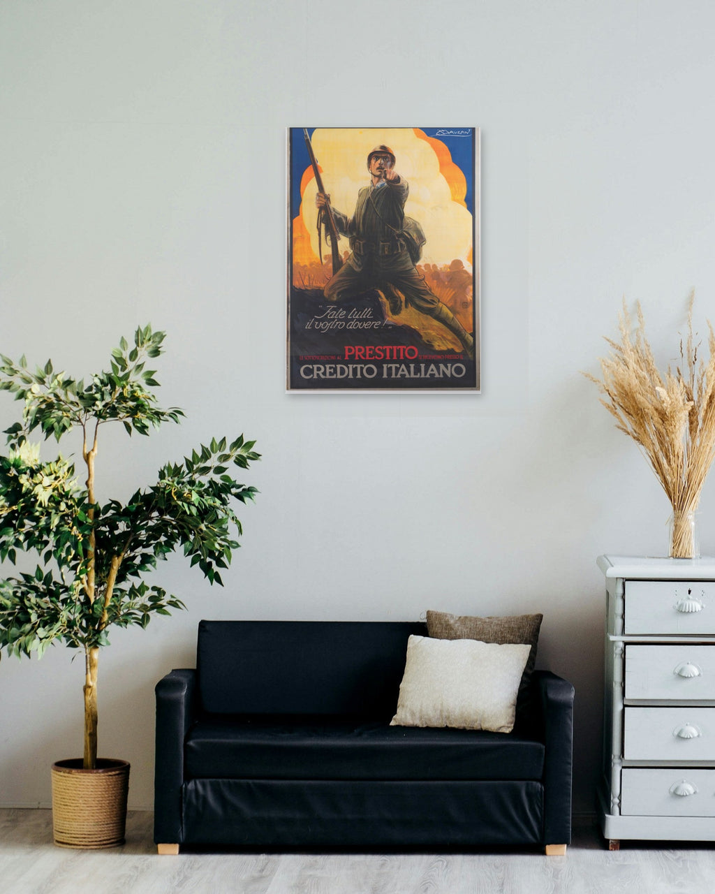 "Fate Tutti il Vostro Dovere!" poster on a living room wall