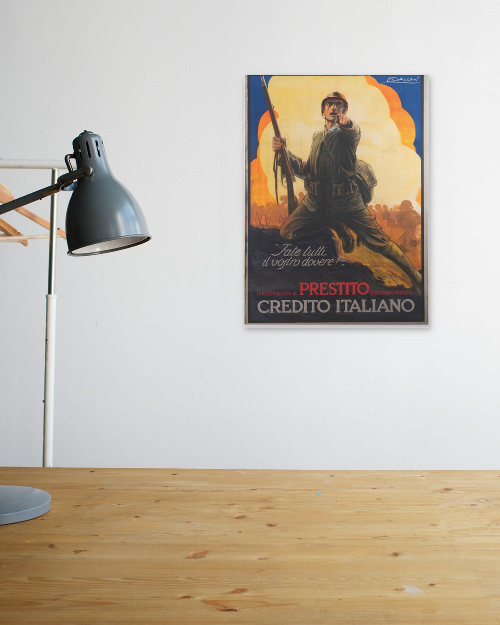 "Fate Tutti il Vostro Dovere!" poster above a wooden desk