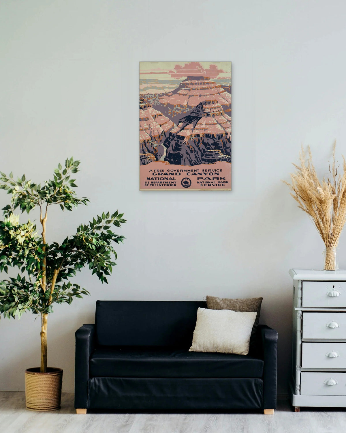 "Grand Canyon National Park" poster on a living room wall