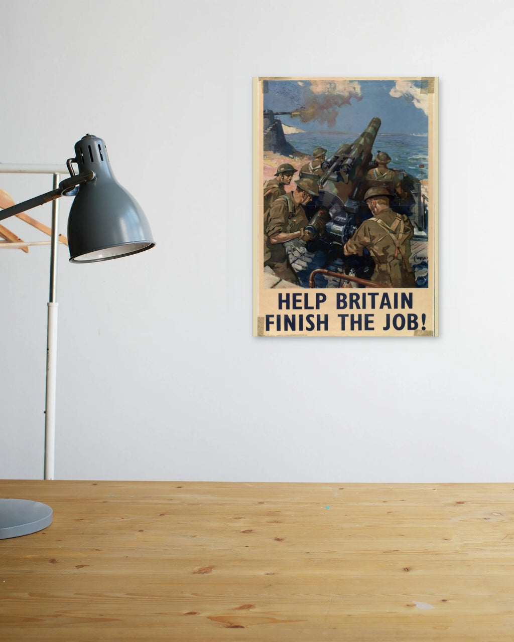 "Help Britain Finish the Job" poster above a wooden desk