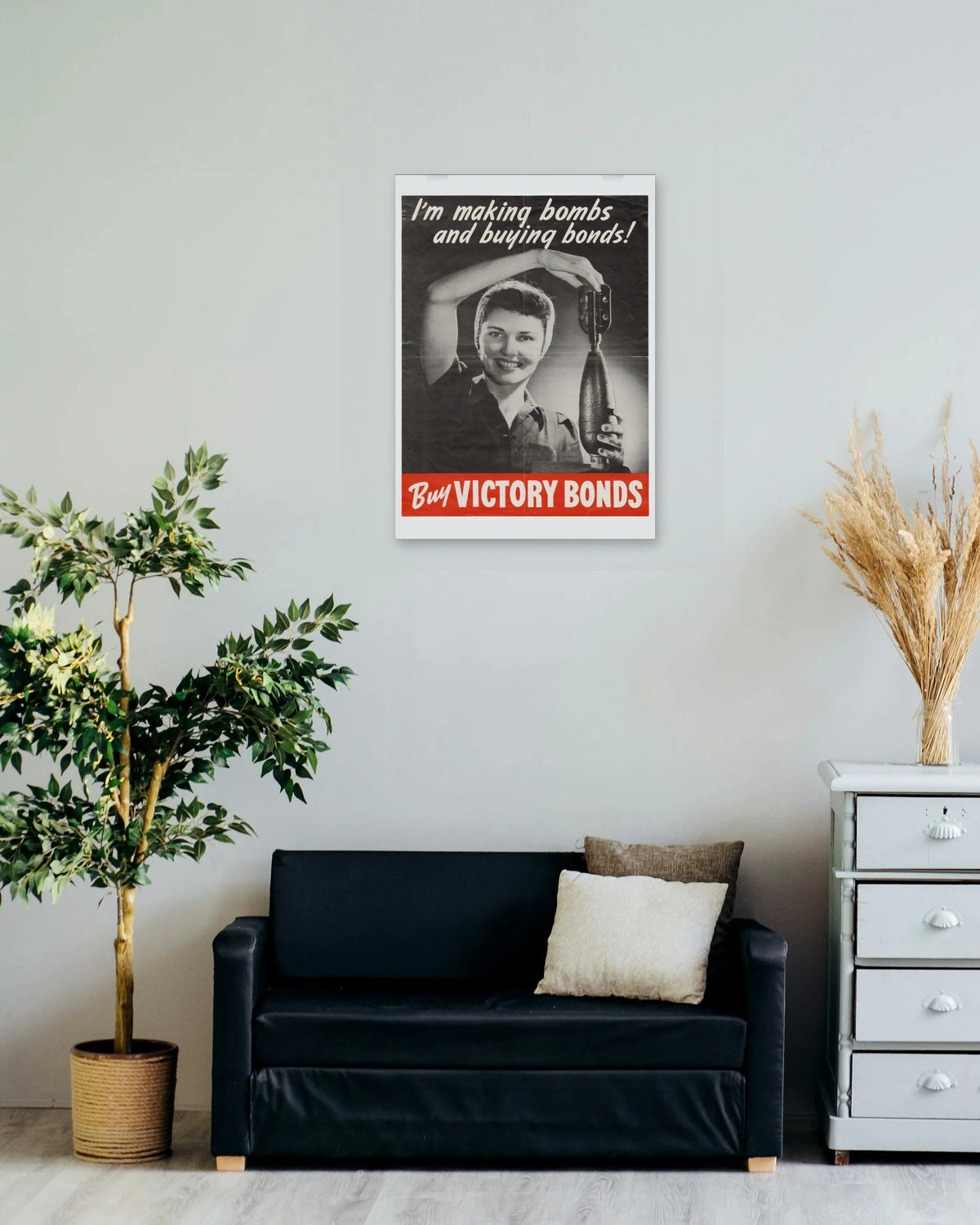 "I'm Making Bombs and Buying Bonds!" poster on a living room wall