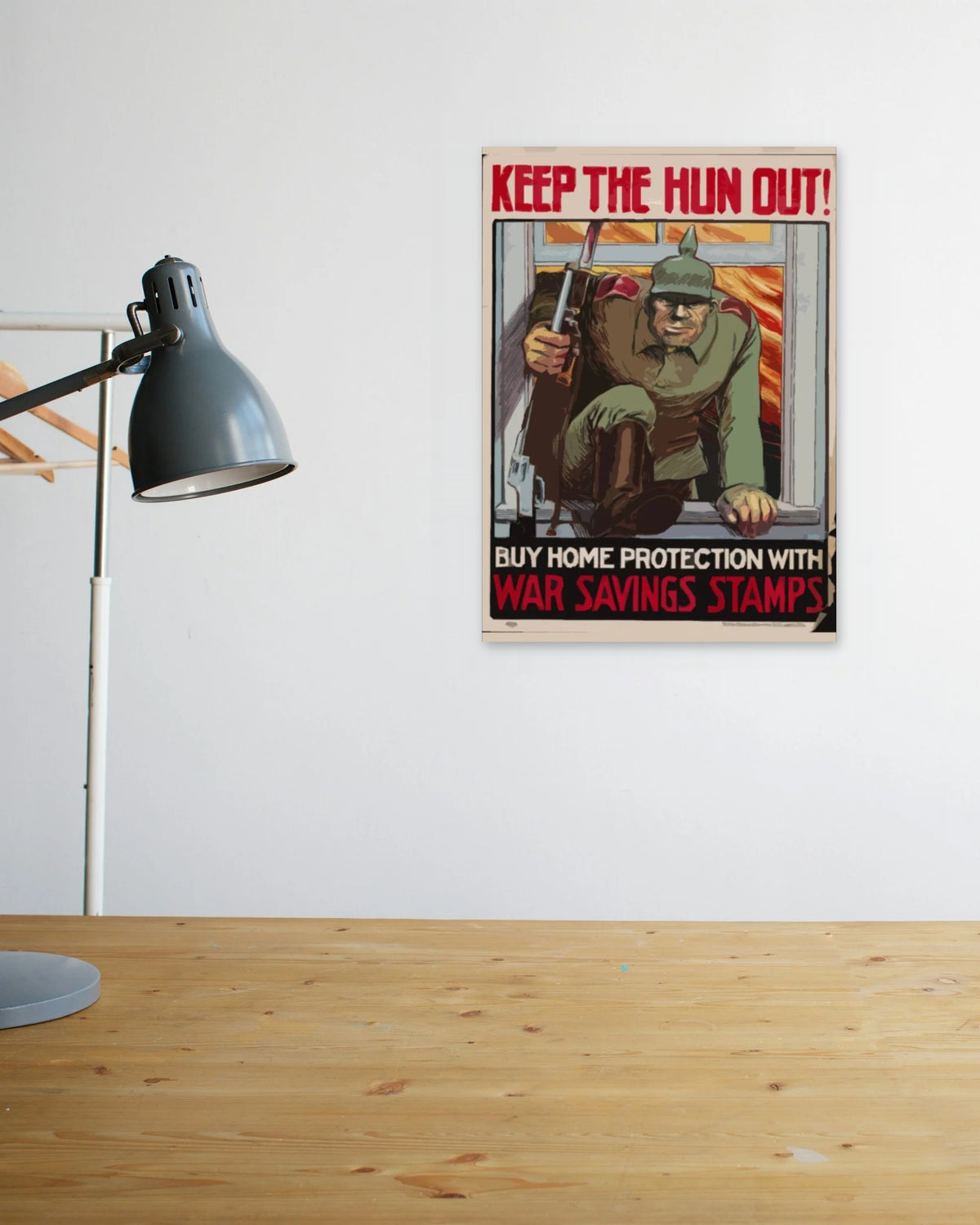 "Keep the Hun Out" poster above a wooden desk