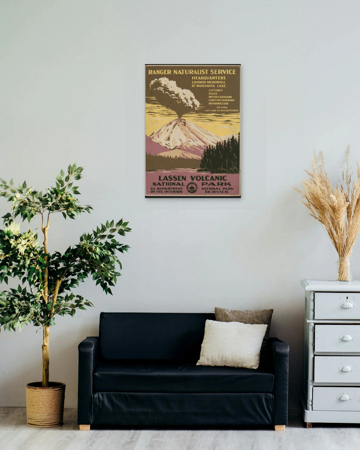 "Lassen Volcanic National Park" poster on a living room wall