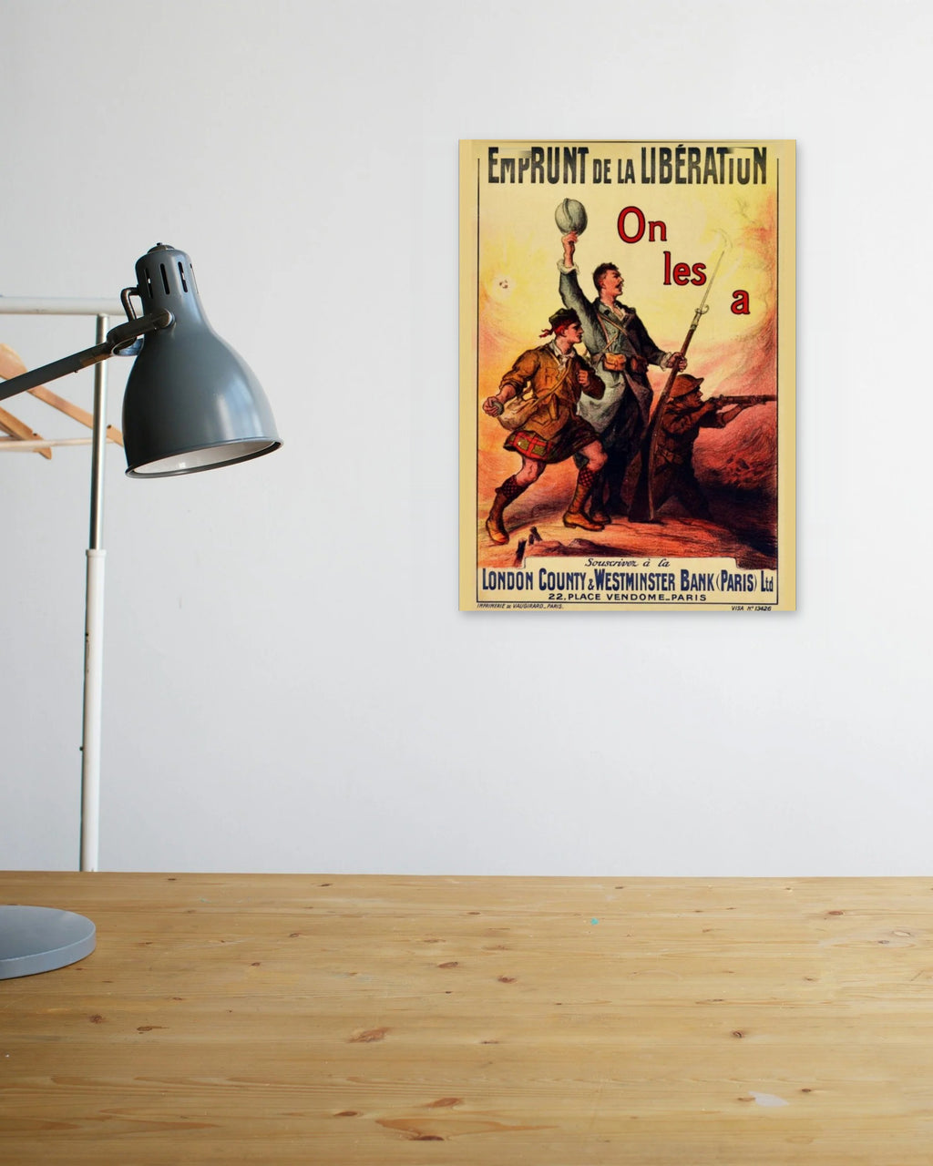 "Loan of Liberation" poster above a wooden desk