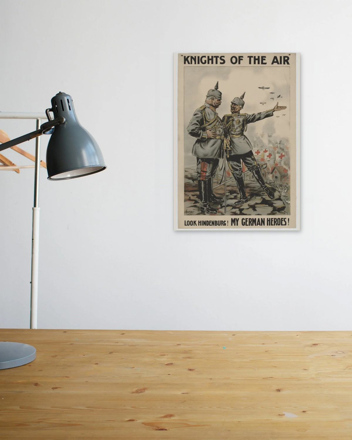 "Look Hindenburg, My German Heroes" poster above a wooden desk
