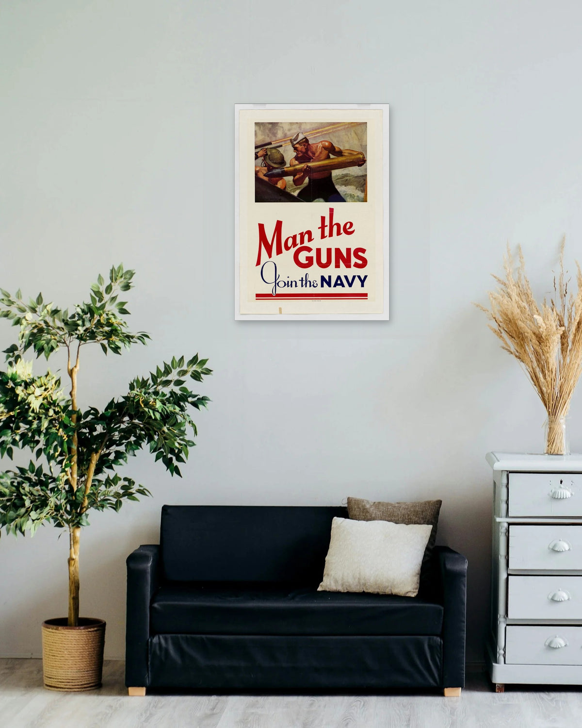 "Man the Guns! Join the Navy" poster on a living room wall