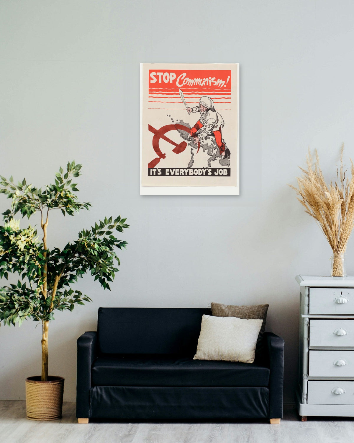 "Stop Communism! It's Everybody's Job" poster on a living room wall