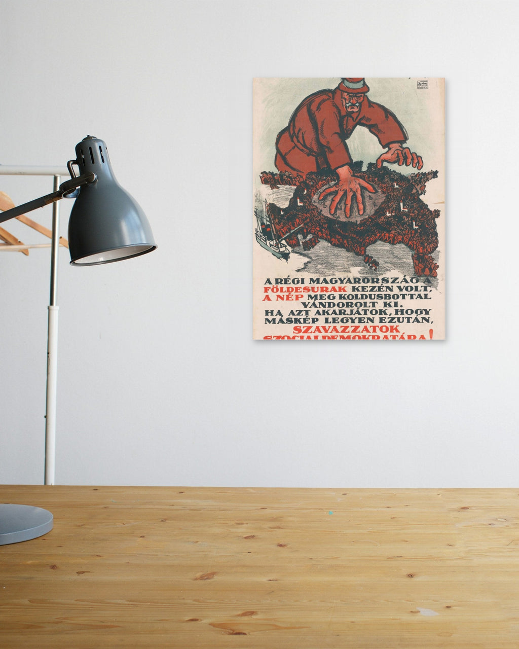 "Szavazzatok Szociáldemokratára!" poster above a wooden desk