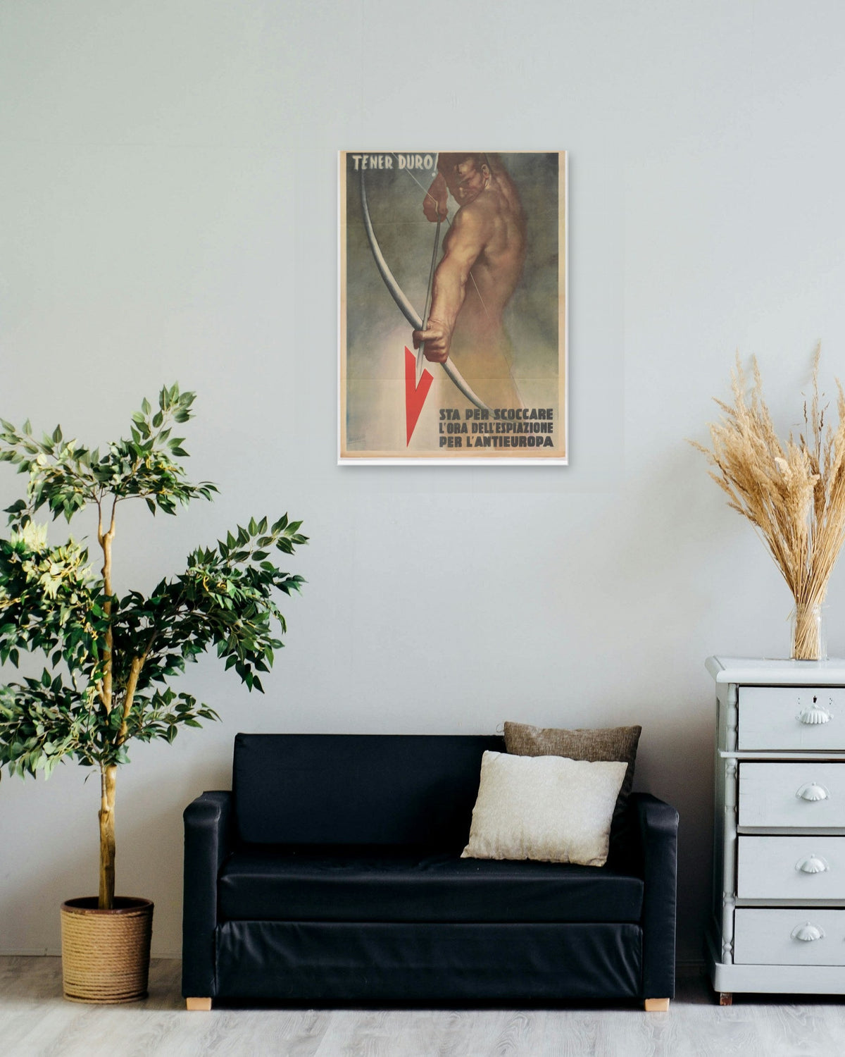 "Tener Duro! (Hold On!)" poster on a living room wall