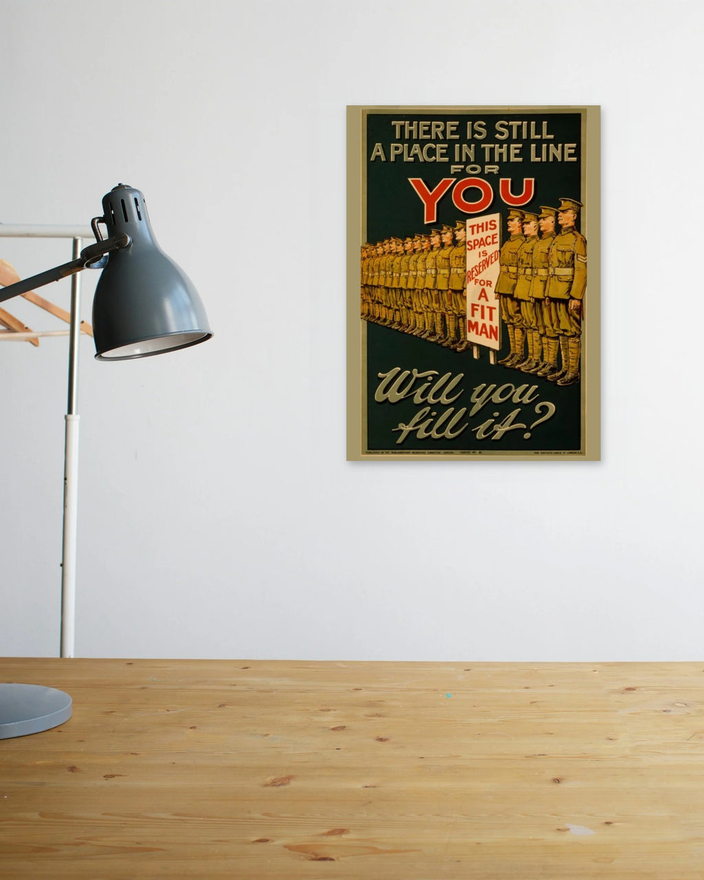 "There Is Still a Place for You in the Line" poster above a wooden desk