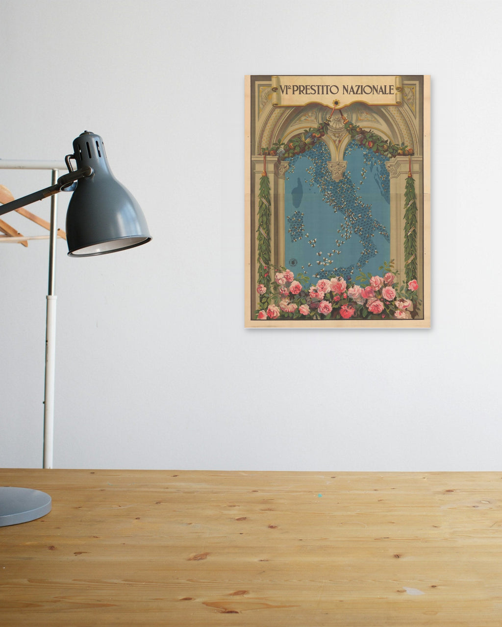 "VI Prestito Nazionale" poster above a wooden desk