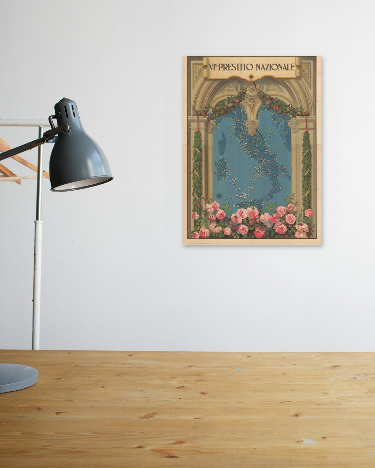 "VI Prestito Nazionale" poster above a wooden desk