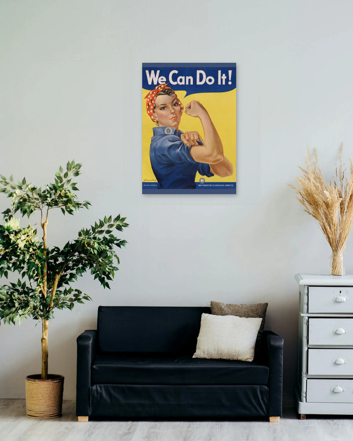 "We Can Do It!" poster on a living room wall