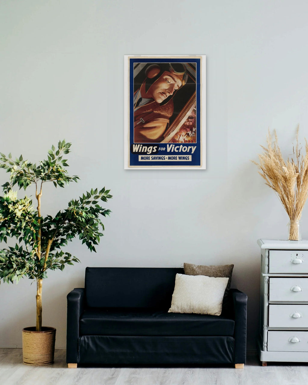 "Wings for Victory" poster on a living room wall